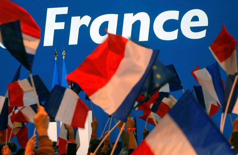 Supporters of Emmanuel Macron wait for his arrival at the Parc des Expositions hall in Paris. Philippe Wojazer / Reuters