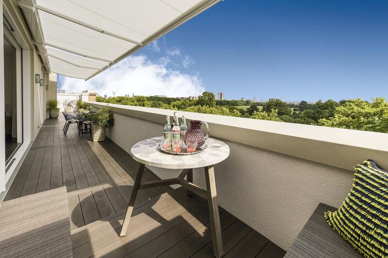The impressive private terrace spans the length of the property and provides an unparalleled aspect with unobstructed views above the treeline and across the vast open spaces of Hyde Park. Courtesy Berkshire Hathaway HomeServices London