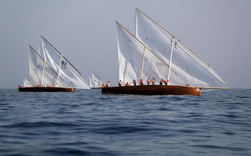 Sailors participate in the annual long-distance dhow sailing race, known as Al Gaffal, near Sir Abu Nair island towards Duba.  AFP