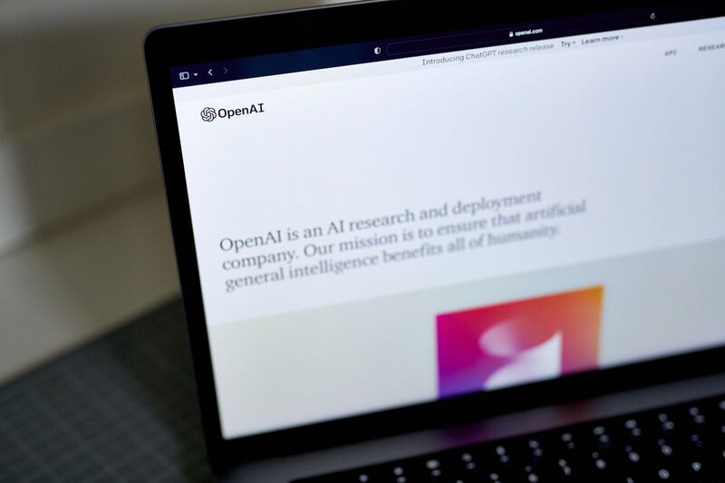 The OpenAI website on a laptop computer. Microsoft has invested again in the creator of ChatGPT. Bloomberg