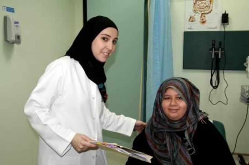 Clinical coordinator Salma Al Nabulsi with patient Afnan Al Thaqafi.

Credit: Caryle Murphy/The National