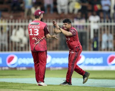 Sharjah, United Arab Emirates - November 22, 2018: Pravin Tambe of Sindhis takes the wicket of Knights' Fabian Allen to take a hitrick during the game between Kerala Knights and Sindhis in the T10 league. Thursday the 22nd of November 2018 at Sharjah cricket stadium, Sharjah. Chris Whiteoak / The National