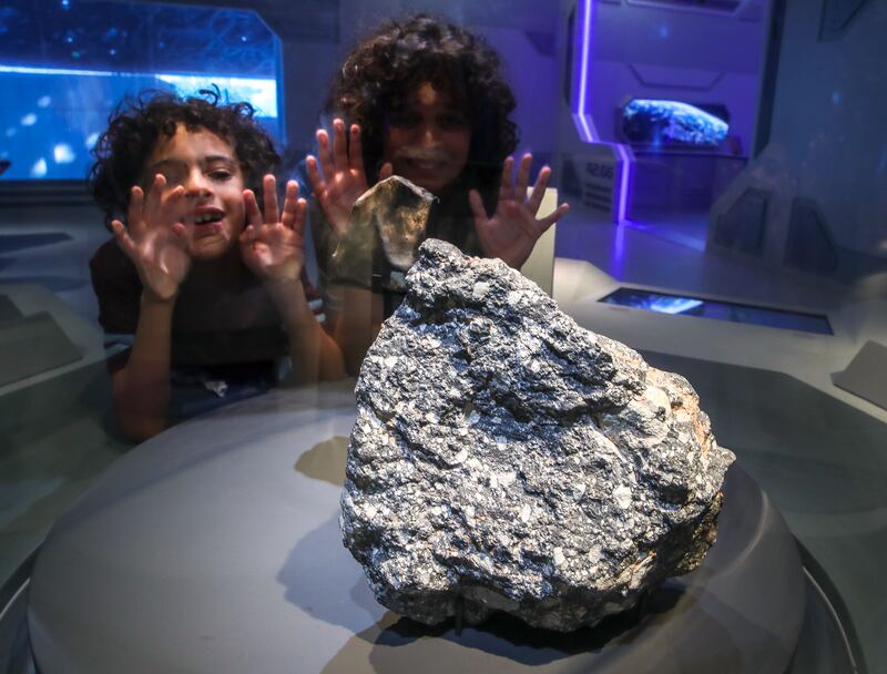 Adam Kamal and Zain Maarouf join young visitors at Louvre Abu Dhabi's latest exhibition Picturing the Cosmos. All photos: Victor Besa / The National