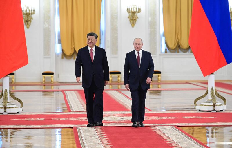 Russian President Vladimir Putin, right, meets China's President Xi Jinping at the Kremlin in Moscow. AFP