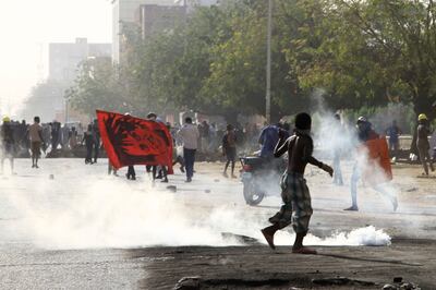Sudanese riot police fire teargas towards anti-coup protesters in Khartoum. AFP