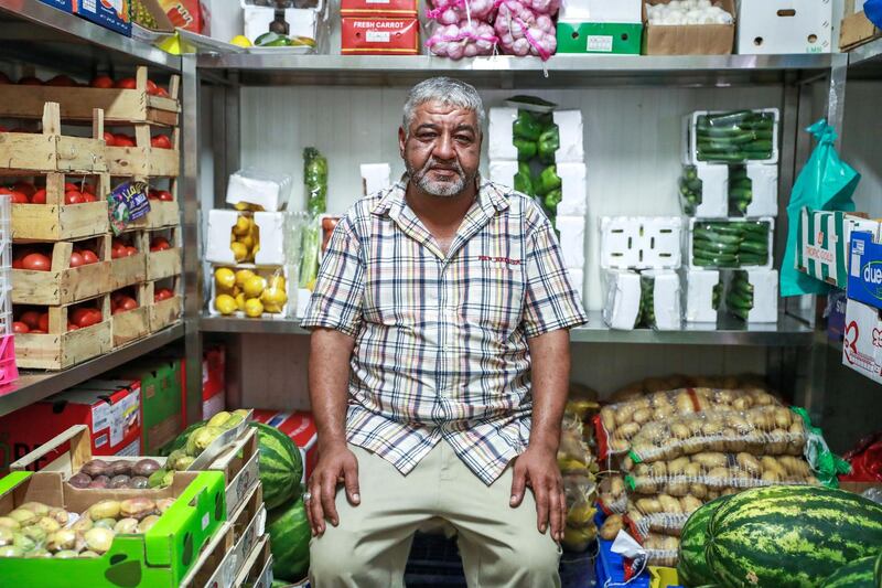 Abu Dhabi, U.A.E., July 30, 2018.   Fruits and Vegetable Market at Al Mina.  -- Veteran fruits and vegetable dealer, Mohammad Nasser Rifai from Syria inside one of his refrigerated rooms.
Victor Besa / The National
Section:  NA
Reporter:  Anna Zacharias