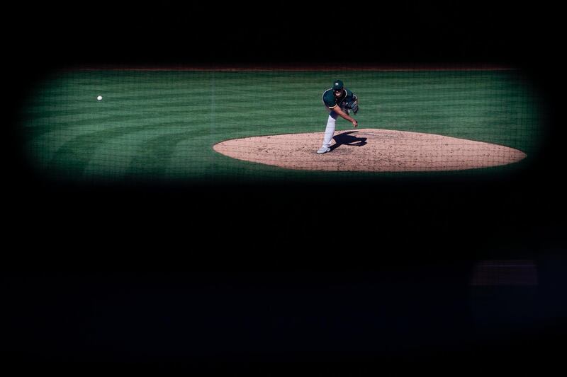 Oakland Athletics relief pitcher Burch Smith throws during the sixth inning of a MLB spring training game against the Arizona Diamondbacks in Scottdale on Tuesday, March 16. AP