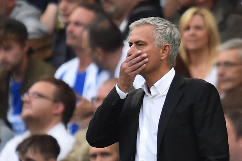 TOPSHOT - Manchester United's Portuguese manager Jose Mourinho gestures from the touchline during the English Premier League football match between Brighton and Hove Albion and Manchester United at the American Express Community Stadium in Brighton, southern England on August 19, 2018. (Photo by Glyn KIRK / AFP) / RESTRICTED TO EDITORIAL USE. No use with unauthorized audio, video, data, fixture lists, club/league logos or 'live' services. Online in-match use limited to 120 images. An additional 40 images may be used in extra time. No video emulation. Social media in-match use limited to 120 images. An additional 40 images may be used in extra time. No use in betting publications, games or single club/league/player publications. / 