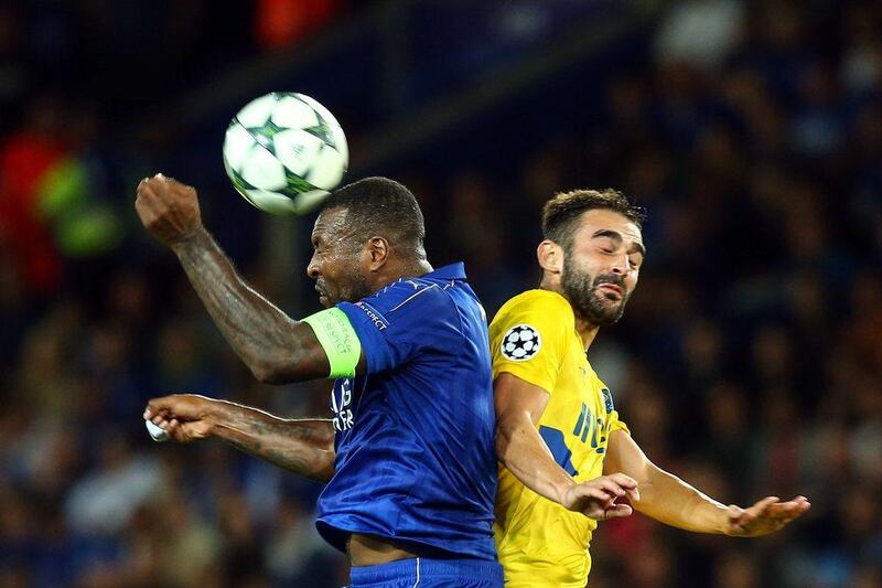 Wes Morgan, left, of Leicester City in action against FC Porto’s Adrian Lopez. Tim Keeton / EPA