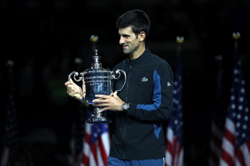 NEW YORK, NY - SEPTEMBER 09: Novak Djokovic of Serbia poses with the championship trophy after winning his men's Singles finals match against Juan Martin del Potro of Argentina on Day Fourteen of the 2018 US Open at the USTA Billie Jean King National Tennis Center on September 9, 2018 in the Flushing neighborhood of the Queens borough of New York City.   Matthew Stockman/Getty Images/AFP
== FOR NEWSPAPERS, INTERNET, TELCOS & TELEVISION USE ONLY ==
