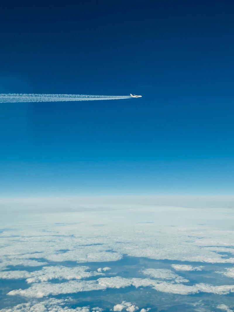 Contrails from a passing jet seen from aboard the Etihad eco-flight EY20