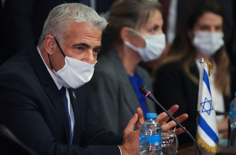 Mr Lapid at the meeting at Tahrir Palace.  Reuters