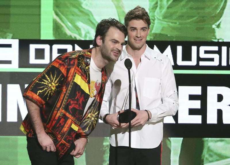 Alex Pall, left, and Andrew Taggart, of The Chainsmokers, accept the award for favorite artist - electronic dance music at the American Music Awards. Matt Sayles / Invision / AP