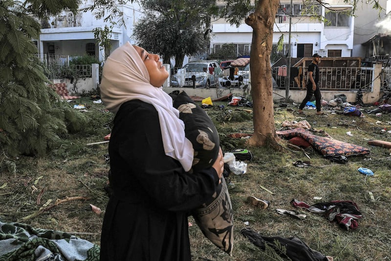 A woman among the debris outside Al Ahli Arab Hospital in central Gaza. AFP
