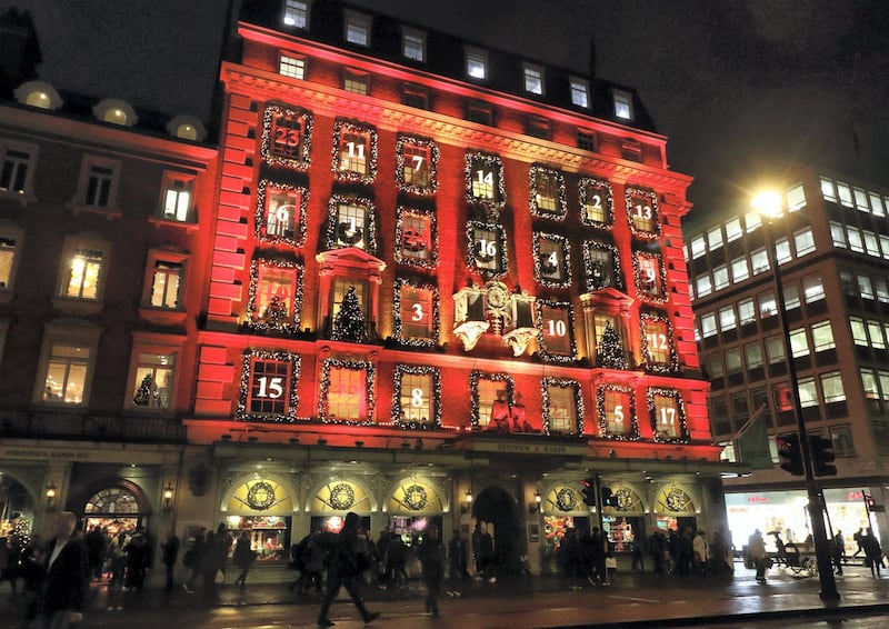 LONDON, UNITED KINGDOM - 2019/12/17: London's upmarket department store Fortnum & Mason in Piccadilly has been transformed into a giant advent calendar this Christmas. 
Its iconic facade is bathed in red with its windows decorated and numbered like a traditional advent calendar. Its windowÂ displays are also some of the best in the capital for the festive season. (Photo by Keith Mayhew/SOPA Images/LightRocket via Getty Images)