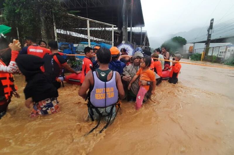 As the typhoon hit, authoritities were warning residents to avoid large crowds as the first cases of the Omicron coronavirus variant were reported. Photo: AP Photo