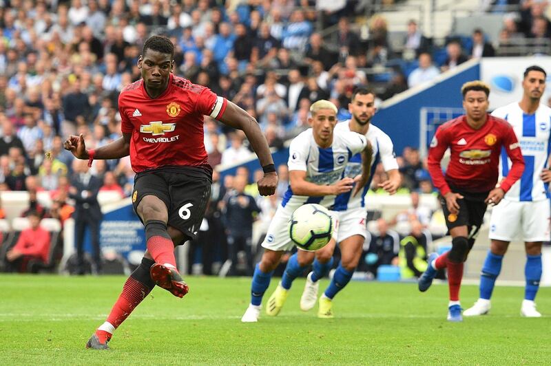 Paul Pogba scores a late penalty for Manchester United's second goal. AFP