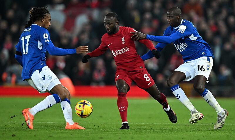 Liverpool midfielder Naby Keita challenges for the ball against Everton midfielders Alex Iwobi and Abdoulaye Doucoure. AFP