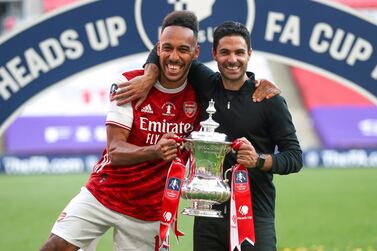 epa08579588 Arsenal’s head coach Mikel Arteta (R) and his player Pierre-Emerick Aubameyang (L) celebrate with the trophy after the English FA Cup final between Arsenal London and Chelsea FC at Wembley stadium in London, Britain, 01 August 2020. EPA/Cath Ivill/NMC/Pool EDITORIAL USE ONLY. No use with unauthorized audio, video, data, fixture lists, club/league logos or 'live' services. Online in-match use limited to 120 images, no video emulation. No use in betting, games or single club/league/player publications.