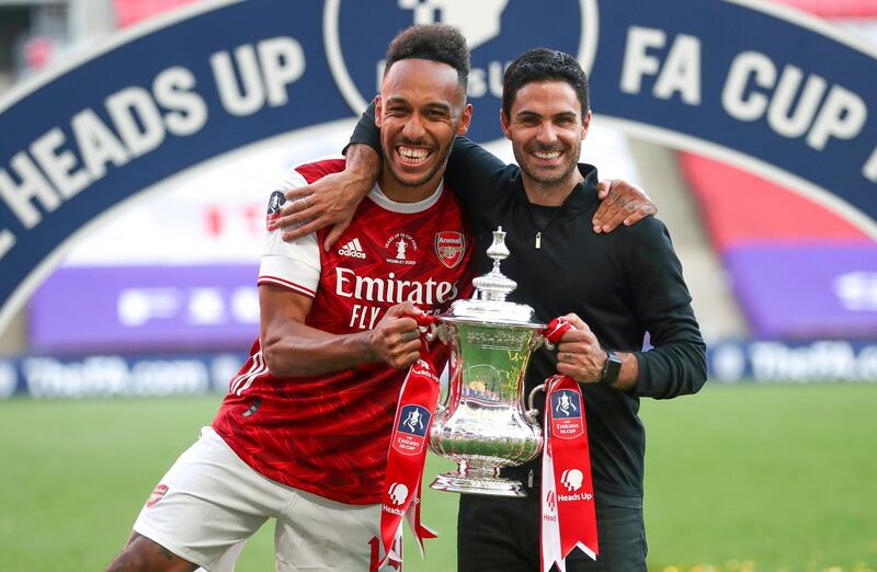 epa08579588 Arsenal’s head coach Mikel Arteta (R) and his player Pierre-Emerick Aubameyang (L) celebrate with the trophy after the English FA Cup final between Arsenal London and Chelsea FC at Wembley stadium in London, Britain, 01 August 2020.  EPA/Cath Ivill/NMC/Pool EDITORIAL USE ONLY. No use with unauthorized audio, video, data, fixture lists, club/league logos or 'live' services. Online in-match use limited to 120 images, no video emulation. No use in betting, games or single club/league/player publications.