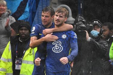 Chelsea's German striker Timo Werner (R) celebrates with teammates after he scores his team's second goal during the English Premier League football match between Chelsea and Southampton at Stamford Bridge in London on October 2, 2021.  (Photo by JUSTIN TALLIS / AFP) / RESTRICTED TO EDITORIAL USE.  No use with unauthorized audio, video, data, fixture lists, club/league logos or 'live' services.  Online in-match use limited to 120 images.  An additional 40 images may be used in extra time.  No video emulation.  Social media in-match use limited to 120 images.  An additional 40 images may be used in extra time.  No use in betting publications, games or single club/league/player publications.   /  