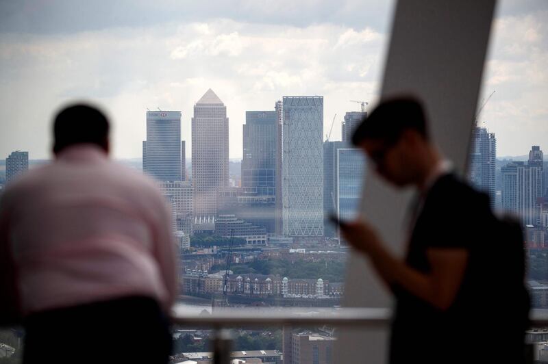 The offices of banks, including JPMorgan Chase, Citi, HSBC, and other financial institutions are pictured in the financial district of Canary Wharf, from iside the Sky Garden in London on July 3, 2019. / AFP / Tolga Akmen
