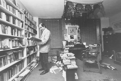 Indian Moslem writer Salman Rushdie in cluttered study going through book before going into hiding after writing SATANIC VERSES for which the Ayatollah Khomeini would soon sentence him to death.  (Photo by Terry Smith/The LIFE Images Collection via Getty Images/Getty Images)
