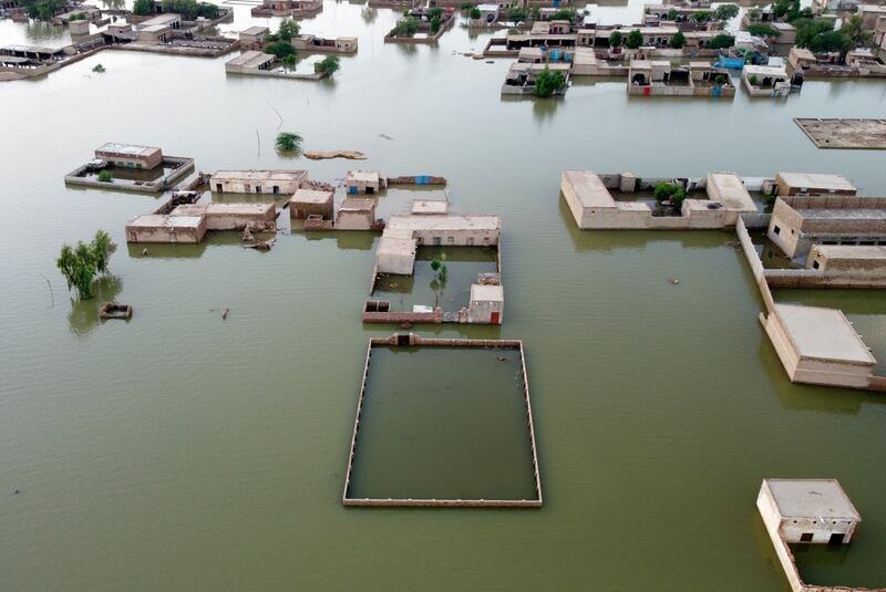 Homes are surrounded by floodwaters in Jaffarabad, a district of Balochistan province. AP