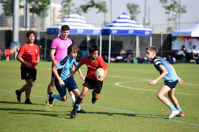 Young rugby players in action at the BSAK Sevens. Khushnum Bhandari / The National