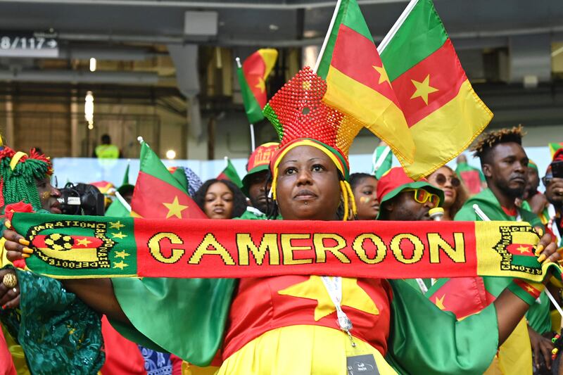 Cameroon fans wait for the start of their match against Switzerland. AFP