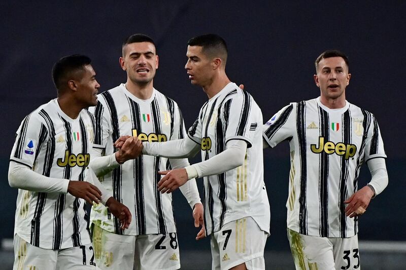 Juventus players celebrate their win. AFP