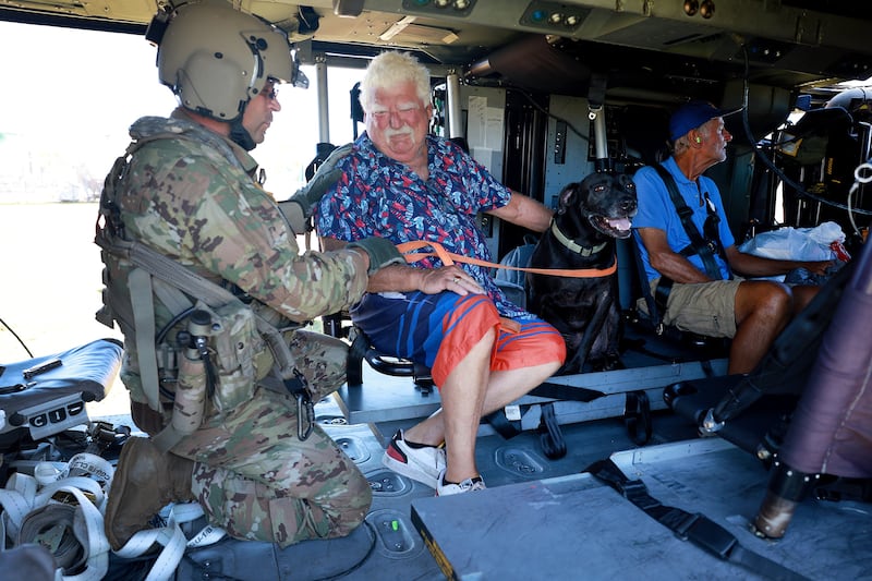 Mr O'Sullivan and Jack settle in for the ride to shelter. Getty / AFP