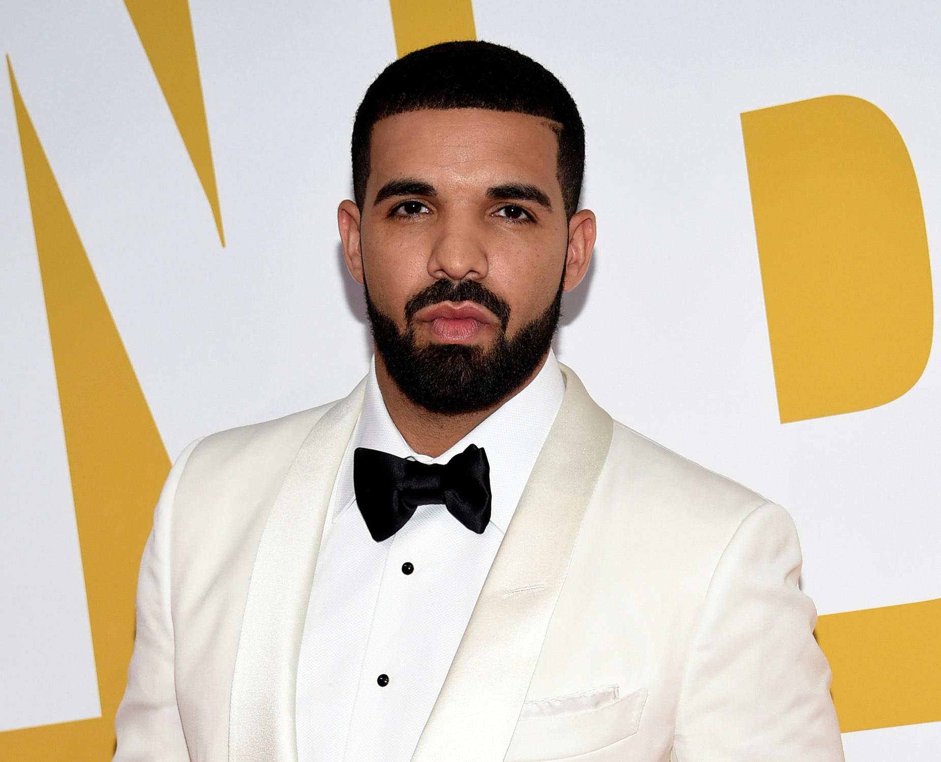 FILE - In this June 26, 2017 file photo, Canadian rapper Drake arrives at the NBA Awards in New York. Drake's song "In My Feelings,"  was named as one of the top songs of the year by Associated Press Music Editor Mesfin Fekadu. (Photo by Evan Agostini/Invision/AP, File)