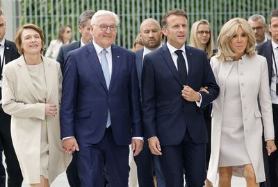 German President Frank-Walter Steinmeier, second left,  his wife Elke Buedenbender, left, with French President Emmanuel Macron and his wife Brigitte, in Berlin on Sunday. AFP