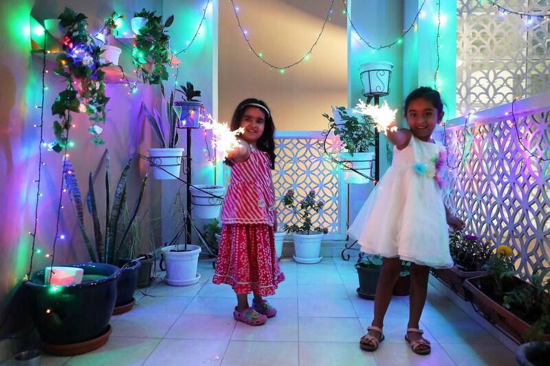 DUBAI, UNITED ARAB EMIRATES , November 14 – 2020 :- Kids celebrating Diwali festival in Dubai. Diwali is the Indian festival of lights. People do prayers and exchange gifts and sweets on this day. (Pawan Singh / The National) For News/Standalone/Online/Instagram/Big Picture