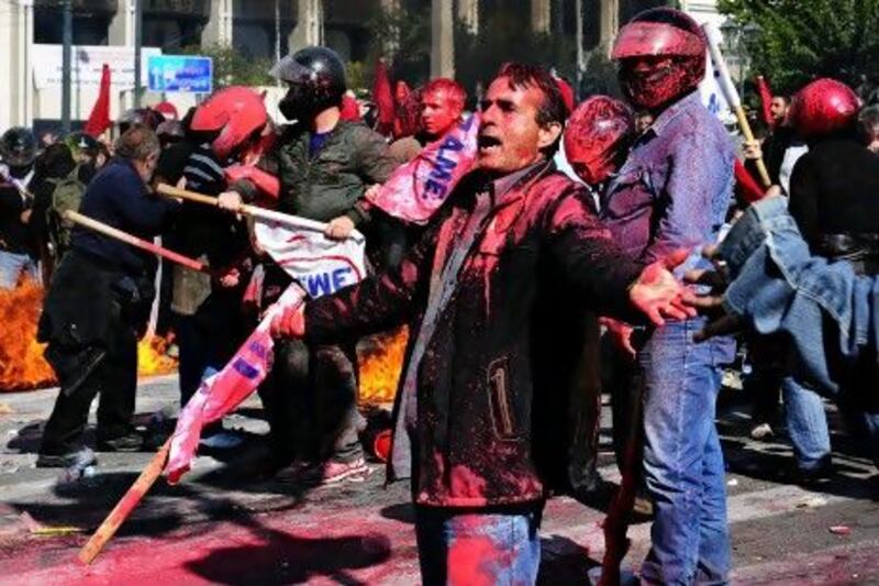 Protesters clash with police in Athens following demonstrations against a new round of austerity measures being debated in parliament. Aris Messinis / AFP