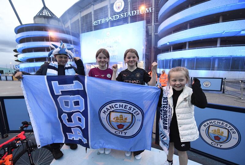 Manchester City supporters celebrate their club winning the Premier League title. EPA