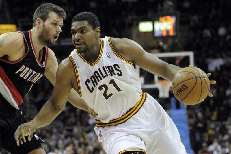 Cleveland Cavaliers center Andrew Bynum, right, drives against Portland Trail Blazers center Joel Freeland. The Cavaliers have suspended Bynum indefinitely for conduct detrimental to the team. David Richard / USA Today