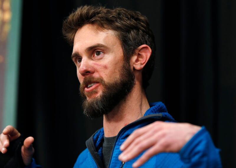 Travis Kauffman responds to questions during a news conference Thursday, Feb. 14, 2019, in Fort Collins, Colo., about his encounter with a mountain lion while running a trail just west of Fort Collins last week. (AP Photo/David Zalubowski)