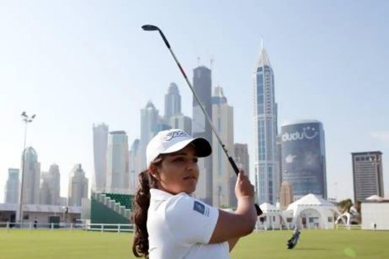 The Dubai-based amateur Kavita Sehmi, 17, practices at the driving range yesterday before she tees off in the Dubai Ladies Masters today at Emirates Golf Club. Sarah Dea / The National