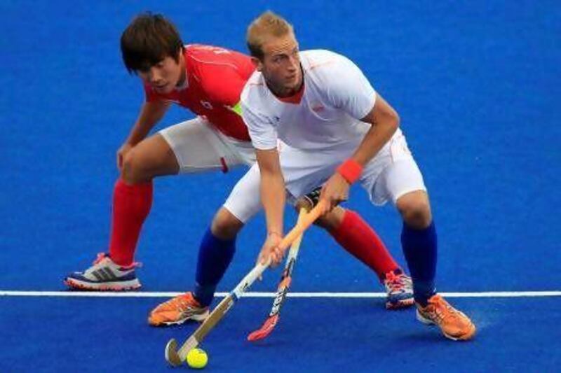 Like the rest of the competitors in hockey, Seungil Lee, left, and South Korea are chasing Billy Bakker and his Netherlands' teammates, along with the Australia team, as those two nations have become the world powers in the sport.