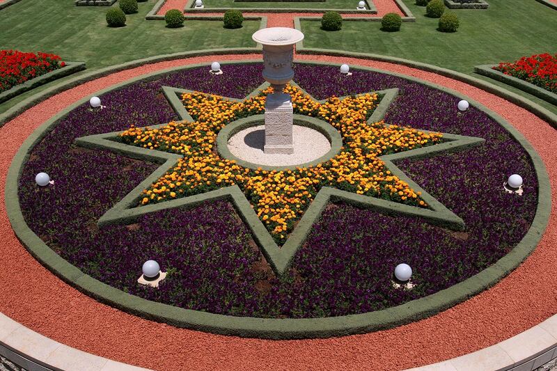 HAIFA, ISRAEL - JULY 14:  A star-shaped flower-bed honors one of the symbols of Bahaism outside the Shrine of the Bab of the Bahai faith July 14, 2008 in the northern Israeli city of Haifa. The world spiritual center of the Bahai faith, whose devotees number less than six million worldwide, was declared a World Heritage Site by UNESCO last week.  (Photo by David Silverman/Getty Images)