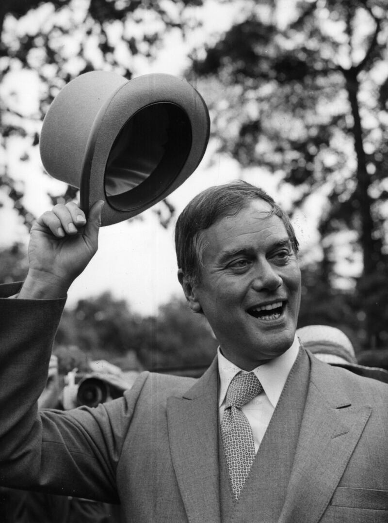 US actor Larry Hagman raising his hat at the Royal Ascot races June 10, 1980. Getty Images