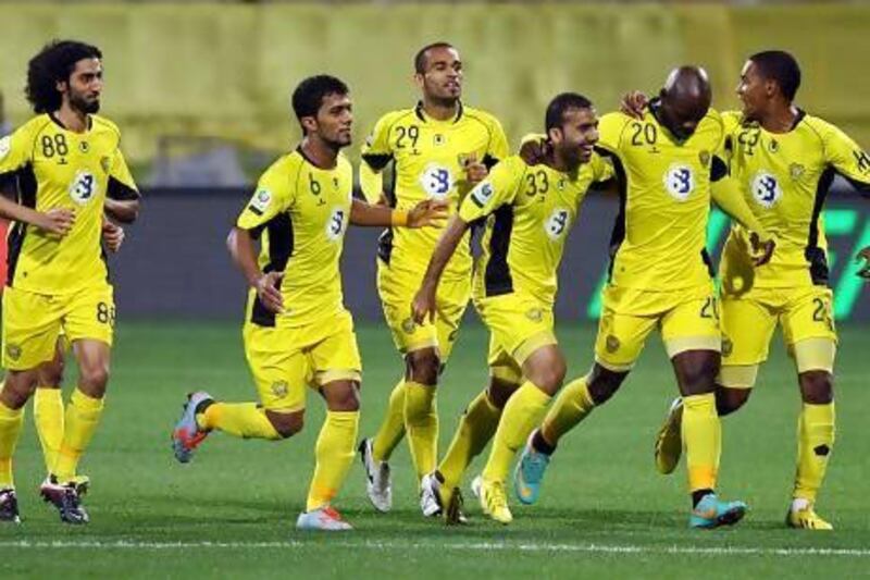 Al Wasl players celebrate after scoring the first goal against Al Ain during their match this week in Dubai. Satish Kumar / The National