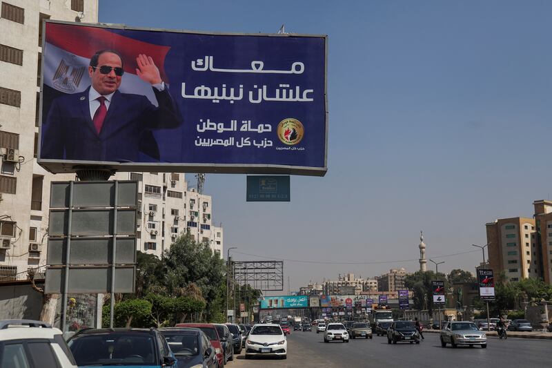 A billboard in Cairo featuring Egypt's President Abdel Fattah El Sisi. 'We are with you to build,' it declares. Reuters