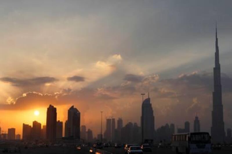 The sun sets over Dubai December 20, 2009. Debt-ridden conglomerate Dubai World is expected on Monday to ask key creditors for more time to pay off its loans, but leave them none the wiser concerning their prospects of being paid back in full.  REUTERS/Ahmed Jadallah (UNITED ARAB EMIRATES - Tags: BUSINESS CITYSCAPE) 


Burj Khalifa skyline *** Local Caption ***  AJS01_DUBAI-_1220_11.JPG