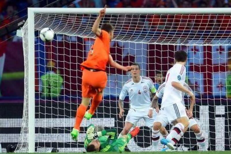 Stare as hard as you might, you cannot stop Klaas-Jan Huntelaar's strike from straying away from the goal.