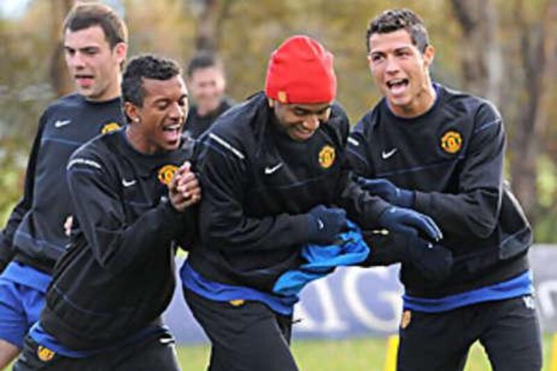 Cristiano Ronaldo, right, Anderson, centre, and Nani, left, in training at Manchester United yesterday.