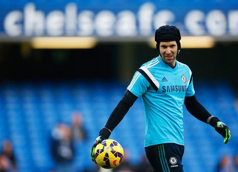 Chelsea goalkeeper Petr Cech warms up prior to their Premier League victory over Hull City on Saturday at Stamford Bridge. Clive Rose / Getty Images / December 13, 2014
