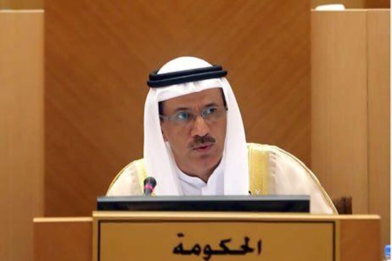 The Minister of Economy, Sultan Al Mansouri, addresses the FNC in Abu Dhabi yesterday. Members passed a raft of amendments to a new law that will encourage Emiratis to start small businesses. Sammy Dallal / The National